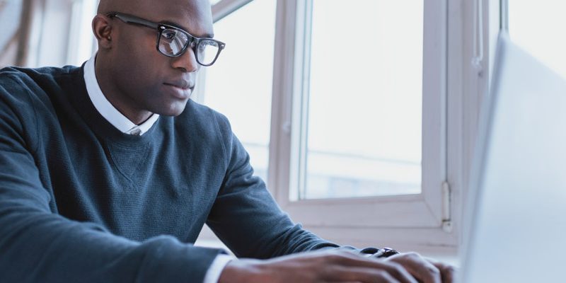 Man typing on a computer