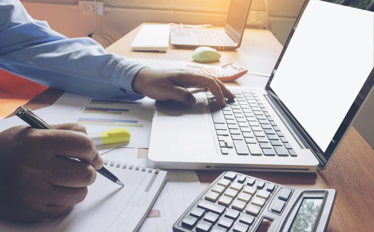 Employee sitting at a laptop working