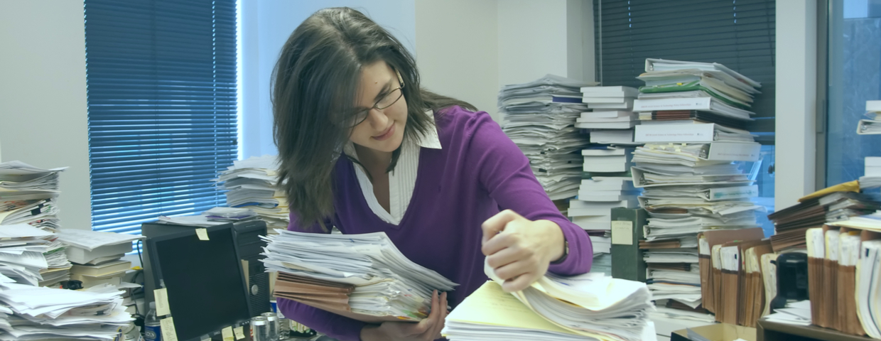 woman sifting through papers