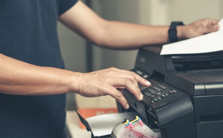 Man using printer in office