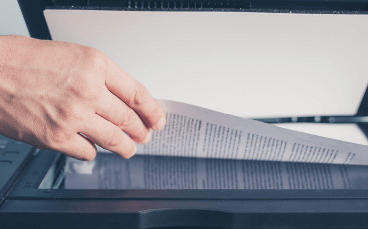 Business man scanning paper