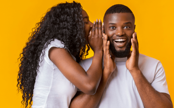 Woman Sharing Secret With Man, guy is excited, yellow background
