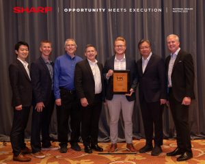 Team members of MMIT Business Solutions Group receiving an award